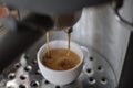 Fresh espresso from coffee machine close up Royalty Free Stock Photo