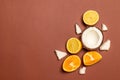 Fresh exotic fruits: pineapple, coconut, orange, lemon on a brown background Royalty Free Stock Photo