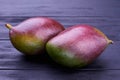 Fresh exotic mango on dark background. Royalty Free Stock Photo