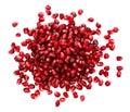 Fresh exotic ruby pomegranate seeds, scattered on isolated white background Royalty Free Stock Photo