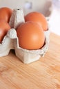 Fresh farm eggs in the cardboard boxes for storing eggs. Packaging for chicken made of recycled waste paper Royalty Free Stock Photo