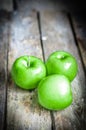 Fresh farm raised apples on rustic wooden background