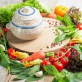 Fresh farm vegetables and herbs on rustic background. Royalty Free Stock Photo