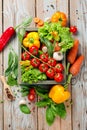 Fresh farm vegetables and herbs on rustic background. Royalty Free Stock Photo