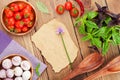 Fresh farmers tomatoes and basil on wood table Royalty Free Stock Photo