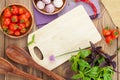 Fresh farmers tomatoes and basil on wood table Royalty Free Stock Photo