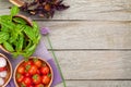 Fresh farmers tomatoes and basil on wood table Royalty Free Stock Photo