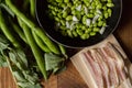 Fresh fava beans with bacon.The broad bean is a species of flowering plant in the Fabaceae family of peas and beans. In young Royalty Free Stock Photo