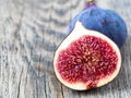 A fresh Fig and cut off half on wooden old table Royalty Free Stock Photo