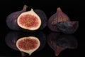 Fresh fig fruit isolated on black glass Royalty Free Stock Photo