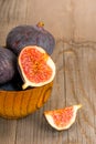 Fresh fig fruits on rustic wooden plate