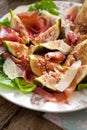 Fresh Fig salad on dark wooden background. Royalty Free Stock Photo