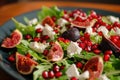 Fresh fig salad with pomegranate seeds, feta cheese, and greens Royalty Free Stock Photo