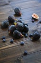 Fresh figs and blueberries on the wooden table Royalty Free Stock Photo