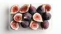 Fresh figs in container displayed on white background Royalty Free Stock Photo