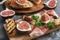 Fresh figs with ham and cheese. Appetizing snack. Selective focus Royalty Free Stock Photo