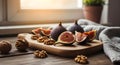 Fresh figs and walnuts artfully arranged on a wooden cutting board, illuminated by soft sunlight, creating a rustic still life Royalty Free Stock Photo