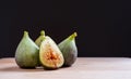 Fresh figs on a wooden table with black background Royalty Free Stock Photo