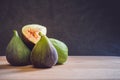 Fresh figs on a wooden table with black background Royalty Free Stock Photo