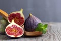 Fresh figs on the wooden table with mint leaves Royalty Free Stock Photo