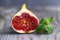 Fresh figs on the wooden table with mint leaves Royalty Free Stock Photo