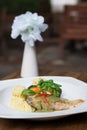 Fresh fillet of sea bass pan fried in lemon caper sauce served with mashed potatoes and green vegetables Royalty Free Stock Photo