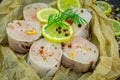 Fresh  fillets of conger eel  with herbs and lemon on black background Royalty Free Stock Photo