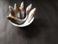 Fresh fish in a bowl on black background