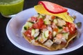 Fresh fish ceviche tostada served at a beach restaurant