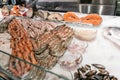 Fresh fish, cuttlefish and shrimp for sale at the fish market France. Seafood on ice on counter . healthy food Royalty Free Stock Photo