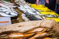 Fresh fish in different sizes laying on a table Royalty Free Stock Photo
