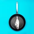 Fresh fish dorado on a frying pan. Royalty Free Stock Photo