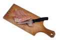 Raw red mullet fillets on a cutting board with a knife close-up on white background