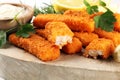 Fresh fish fingers with remoulade sauce. breaded fish fingers with lemon and remoulade Royalty Free Stock Photo