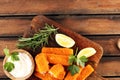 Fresh fish fingers with remoulade sauce. breaded fish fingers with lemon and remoulade Royalty Free Stock Photo