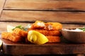 Fresh fish fingers with remoulade sauce. breaded fish fingers with lemon and remoulade Royalty Free Stock Photo