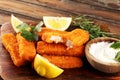 Fresh fish fingers with remoulade sauce. breaded fish fingers with lemon and remoulade Royalty Free Stock Photo