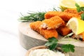 Fresh fish fingers with remoulade sauce. breaded fish fingers with lemon and remoulade Royalty Free Stock Photo