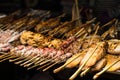 Fresh fish food on barbecue in a street market in Asia. Different type of fish and seaside.