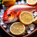 Fresh fish on ice with lemon wedges, seafod for sale cold for freshness