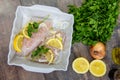 Fresh fish, raw cod fillets with addition of herbs and lemon Royalty Free Stock Photo