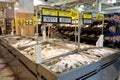 Fresh fish sales department at a grocery store. Fresh fish lies on the counter in ice