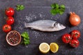 Fresh fish sea bass with ingredients for cooking Royalty Free Stock Photo