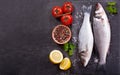 Fresh fish sea bass with ingredients for cooking Royalty Free Stock Photo