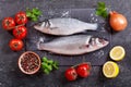 Fresh fish sea bass with ingredients for cooking Royalty Free Stock Photo