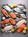 Fresh fish and seafood on grey table, flat lay. Royalty Free Stock Photo