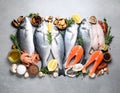 Fresh fish and seafood on grey table, flat lay. Royalty Free Stock Photo