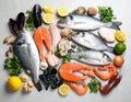 Fresh fish and seafood on grey table, flat lay. Royalty Free Stock Photo