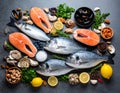 Fresh fish and seafood on grey table, flat lay. Royalty Free Stock Photo