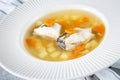 Fresh fish soup with pike perch and vegetables in a white plate Royalty Free Stock Photo